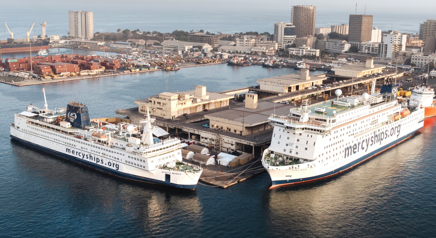 The Africa Mercy (left) and Global Mercy moored together last year in Dakar, Senegal.